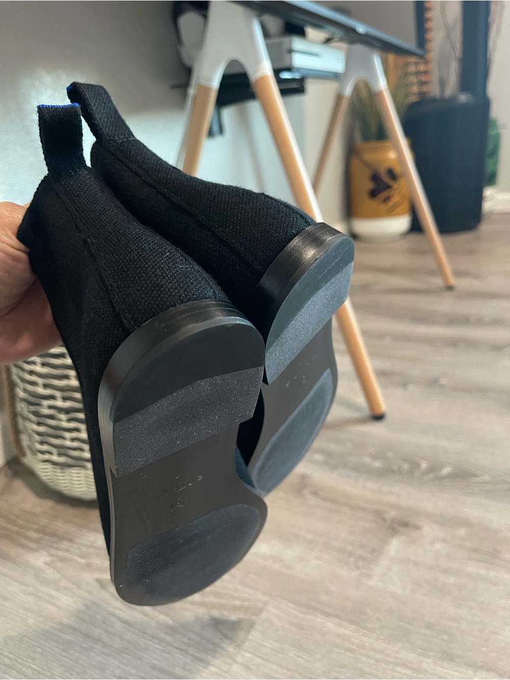 Rothy’s Merino Ankle Boots in onyx black with a distinctive blue pull tab - Picture 10 of 13